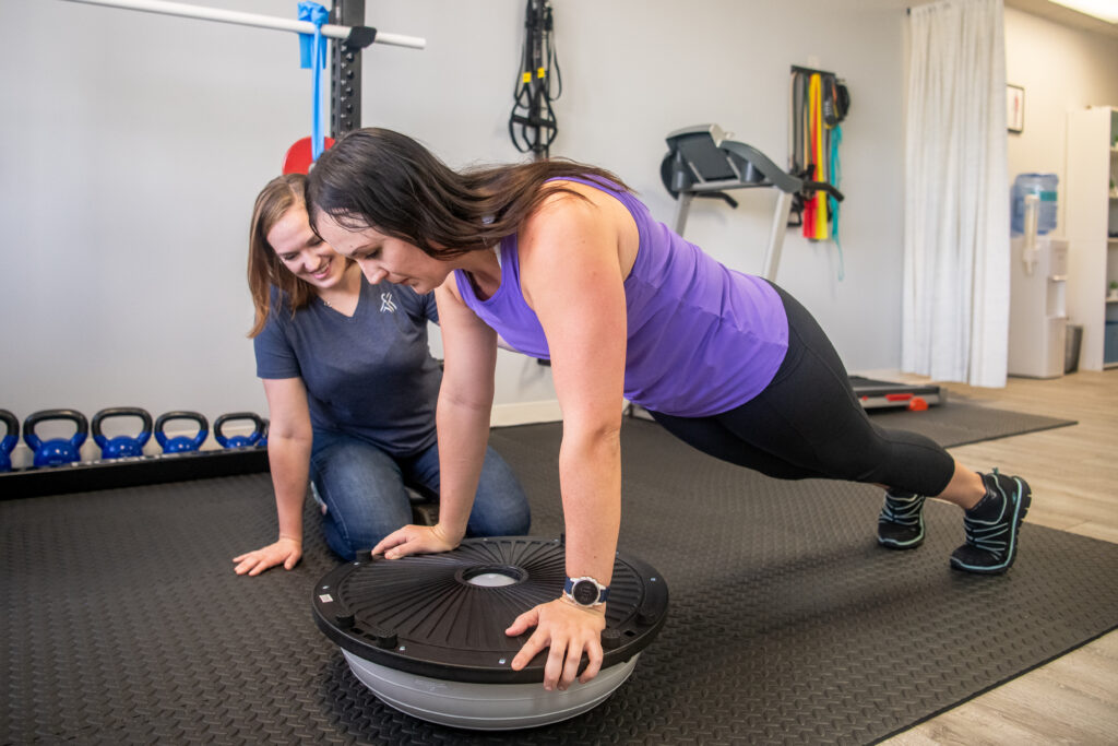 A picture of a patient doing rehab with Dr. Olivia.